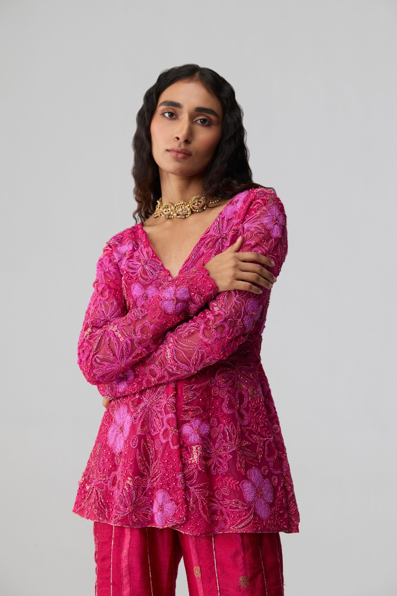 Misra – fuschia pink full-sleeve embroidered peplum kurta with raw silk sharara by Julie & Rinki