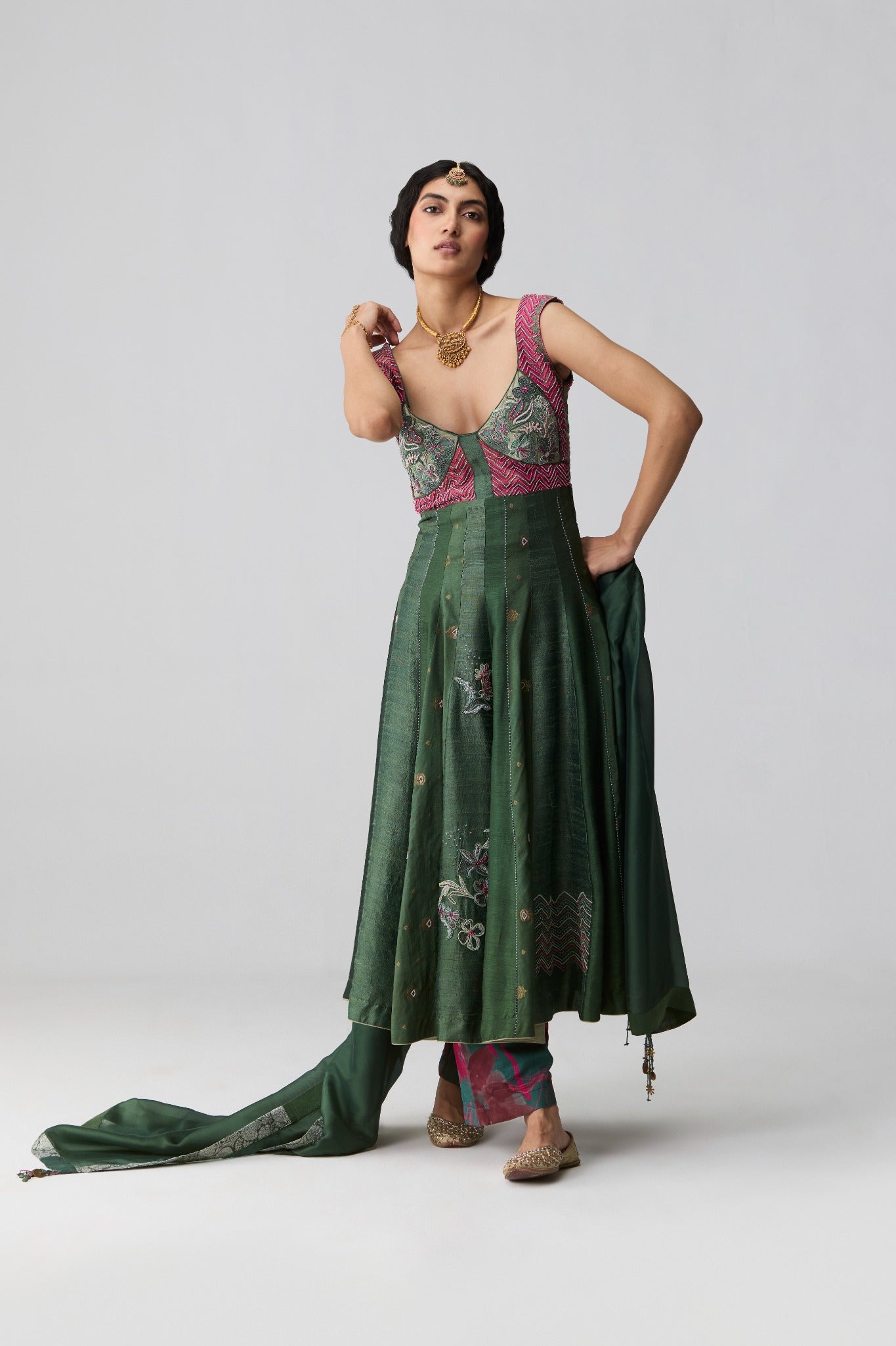 Rua – dark green embroidered yoke Anarkali with Banarasi raw silk panels and organza dupatta by Julie & Rinki